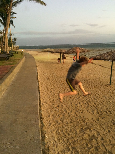 jumping onto the sand at Manly Beach
